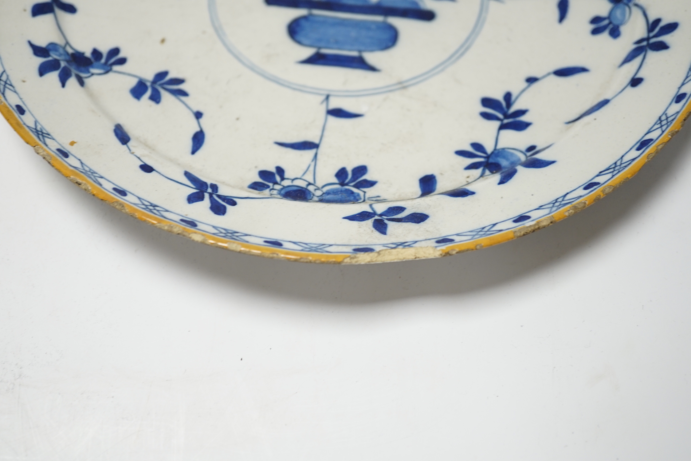 A pair of late 18th century Delft plates and an English delftware plate (3)